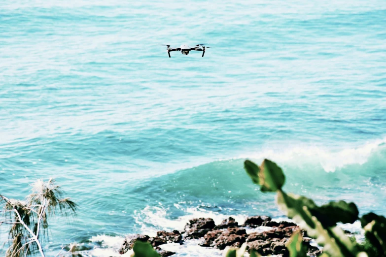 a pair of binoculars hovering over the ocean