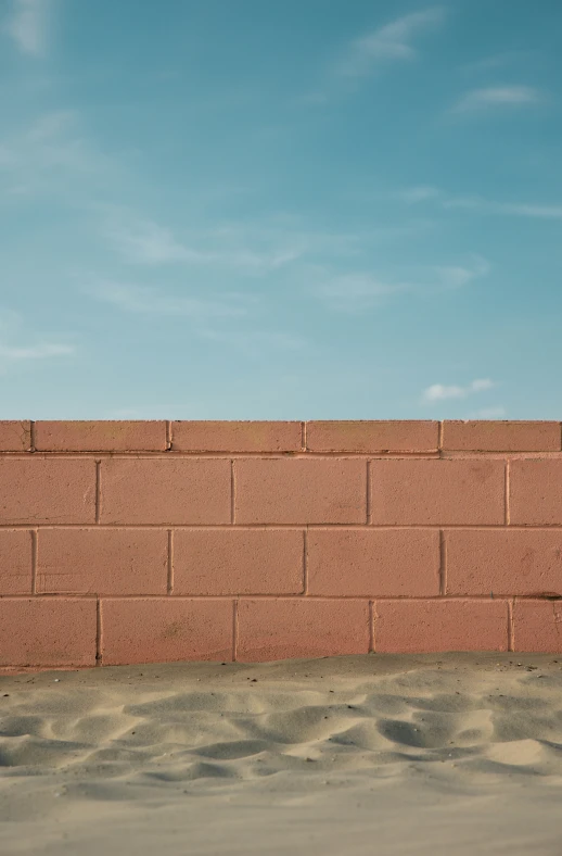 a man is talking on his cell phone on the wall