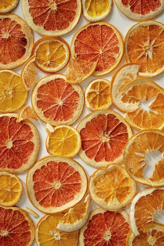 oranges and lemon slices are on the ground