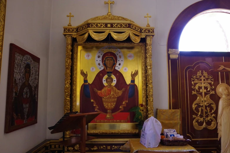 this church has a lot of golden accents and a statue