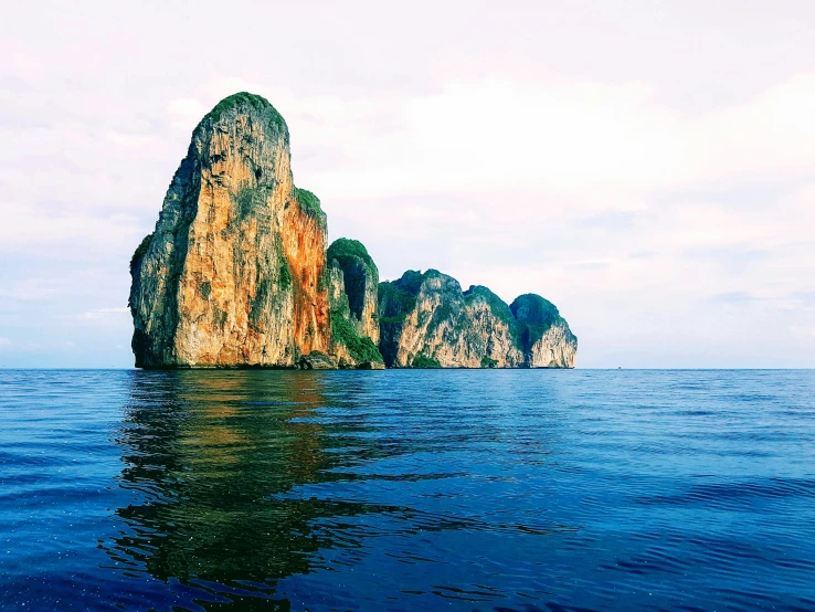 a couple of rocks sitting in the middle of water