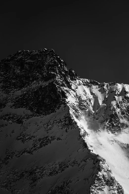 black and white po of a snow covered mountain top