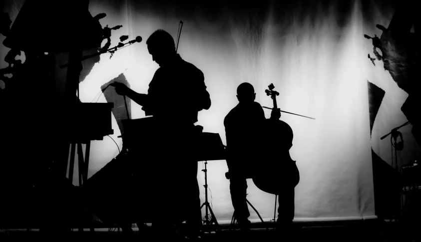 an artistic po of two musicians in black and white