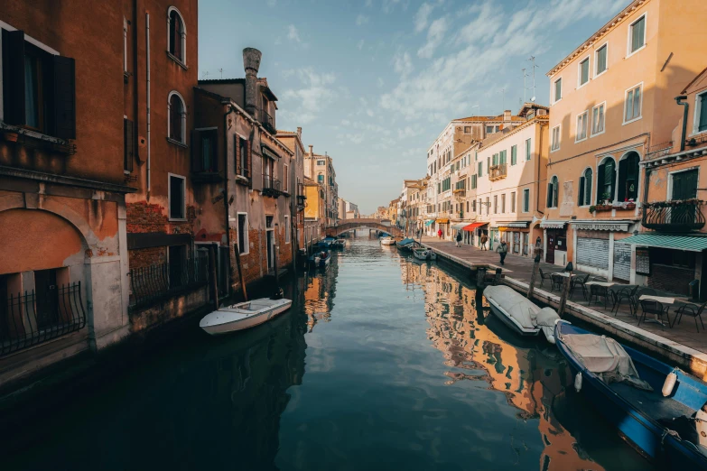 a quiet waterway in the city surrounded by buildings