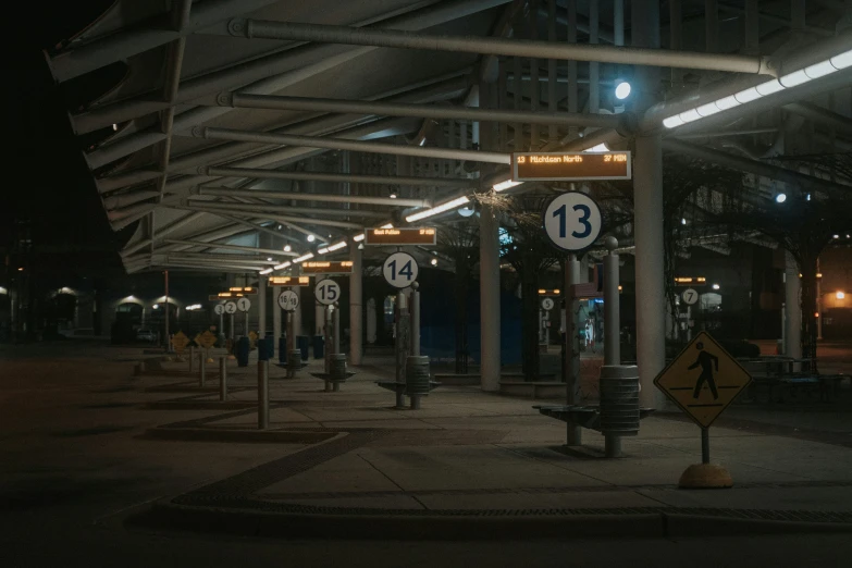 several parking spaces have clocks on them on poles in the center of the building