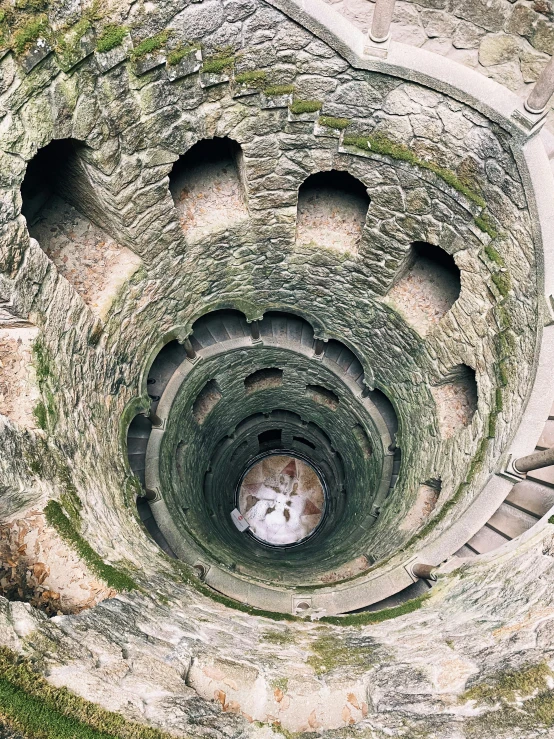 an aerial view of a spiral brick structure