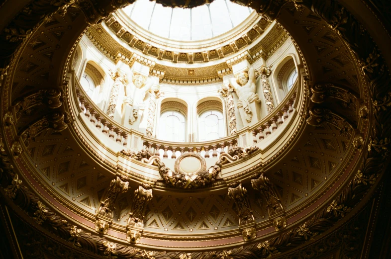 a large circular room with a large domed light fixture above