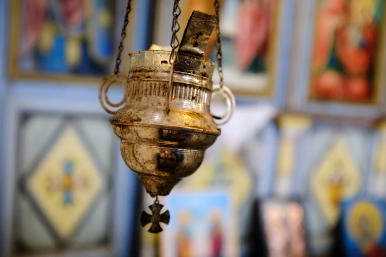 a close up of a candle hanging in a church