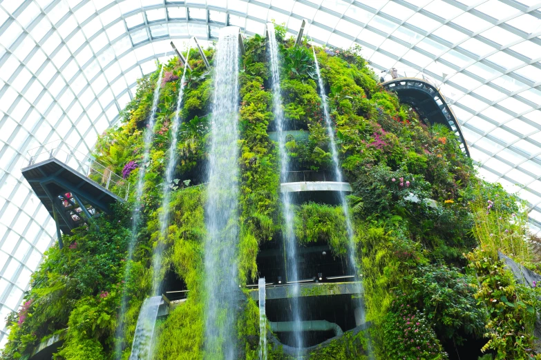 a massive indoor waterfall inside of a building