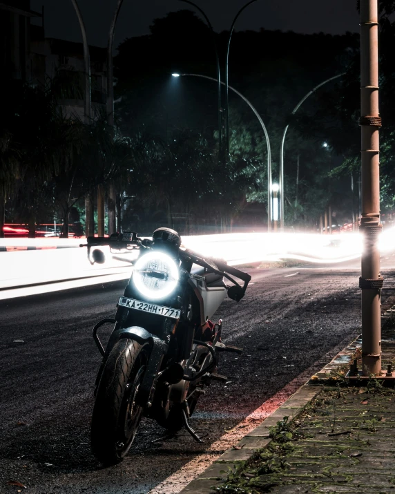 a motorcycle parked on the street at night