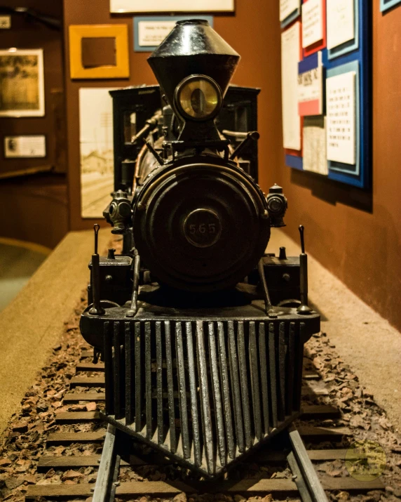 an old train engine sitting on top of a piece of tracks