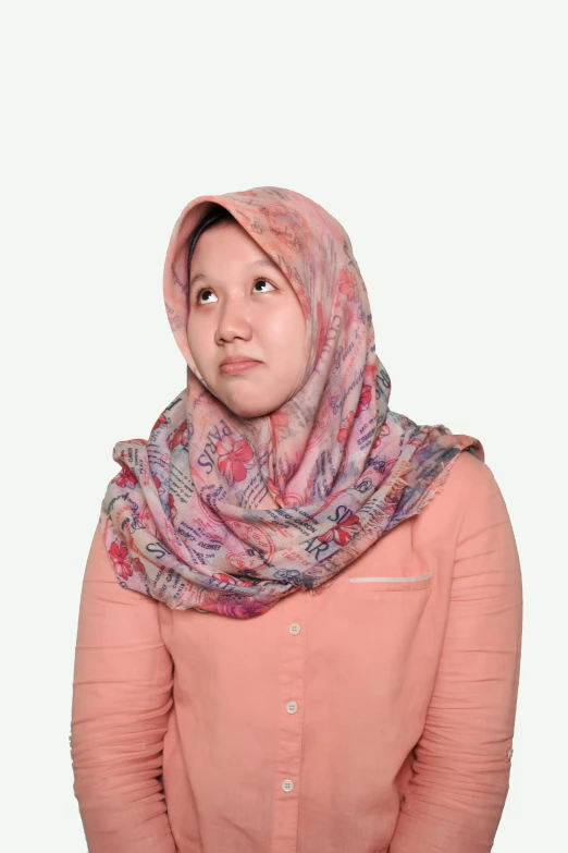 woman wearing pink shirt and head scarf