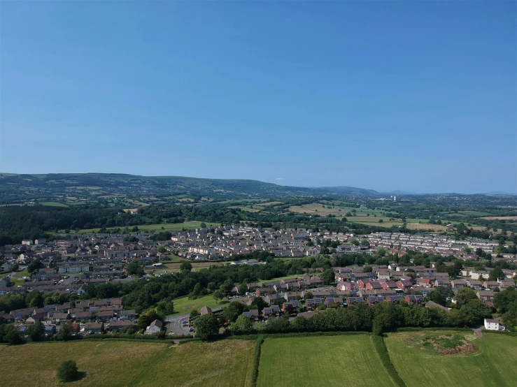 a large open space area with many houses in the distance