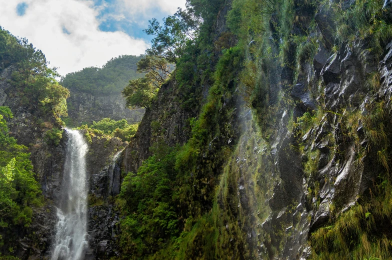 two water fall cascading down the side of a mountain