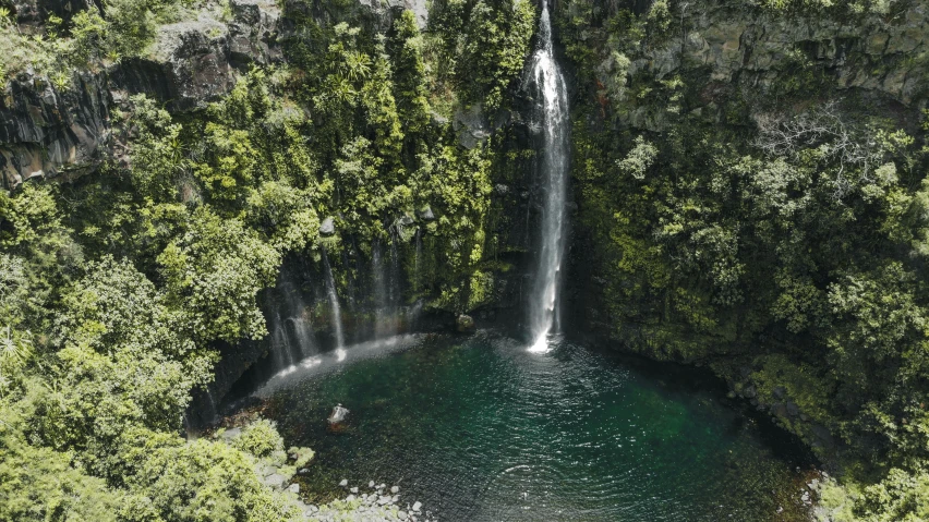 the water is crystal green with waterfall