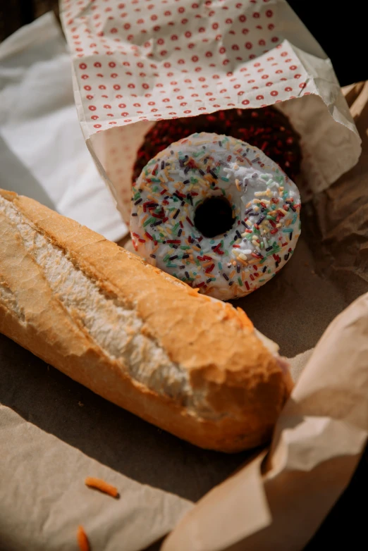 a half - eaten donut and half empty bag