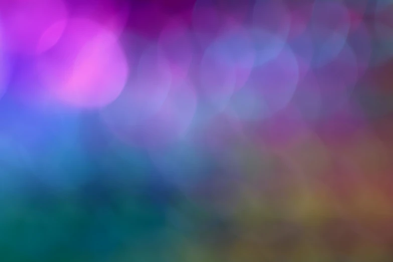 a blurry po of colorful lights on a surface