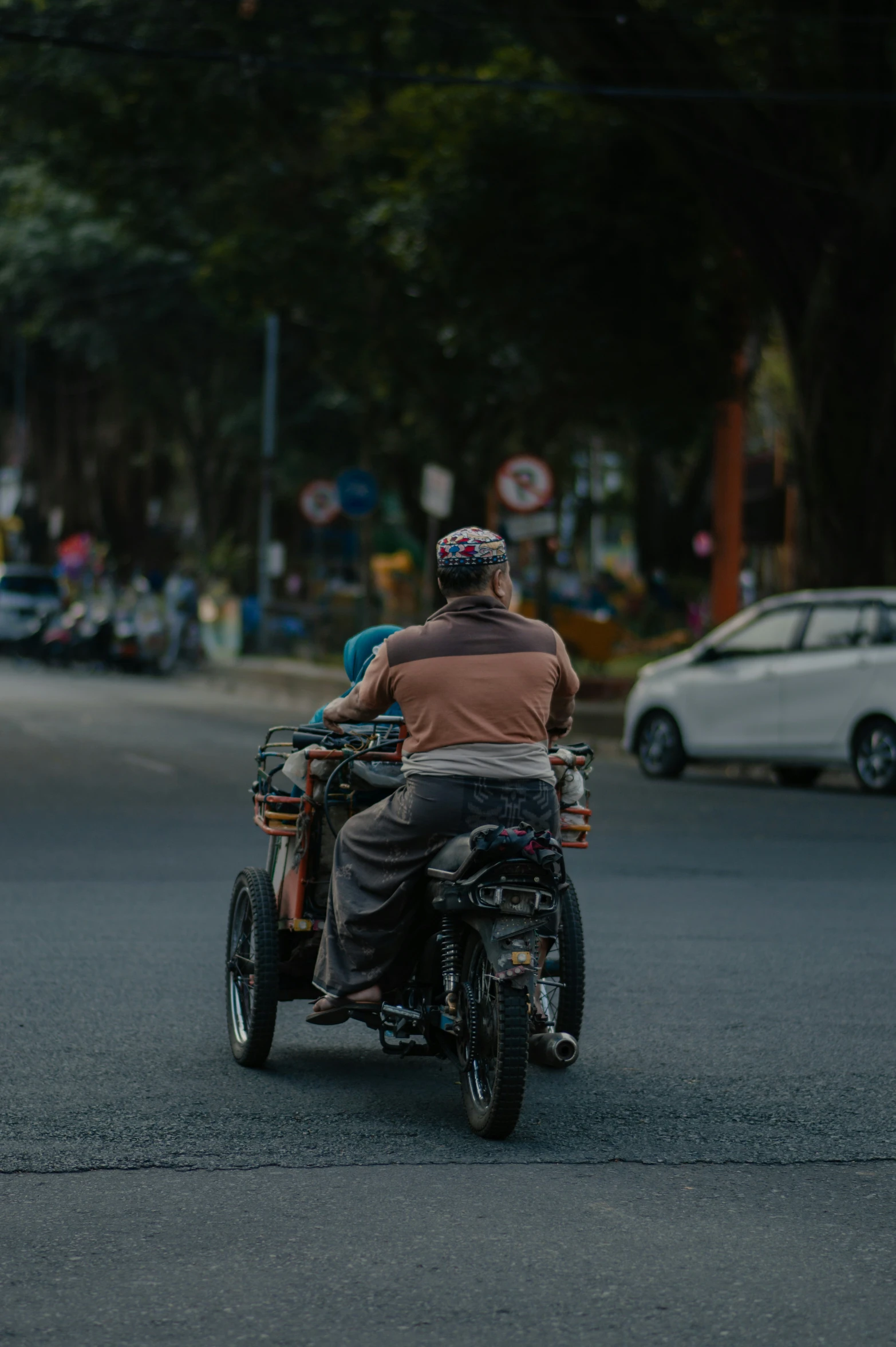 a man is riding a motorcycle in the street