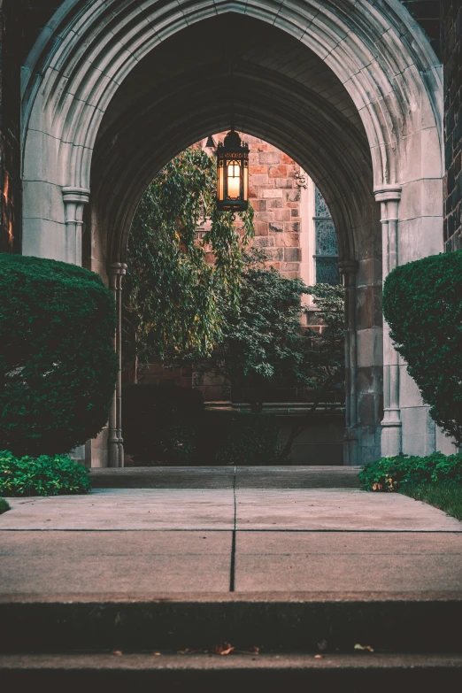 a walkway leading to a big arch in the side