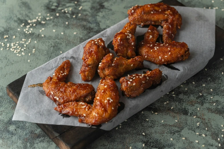 several fried chicken on a piece of paper