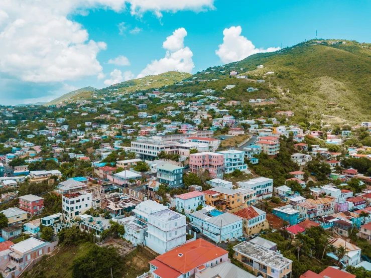 a picture of a city and hill that has blue buildings