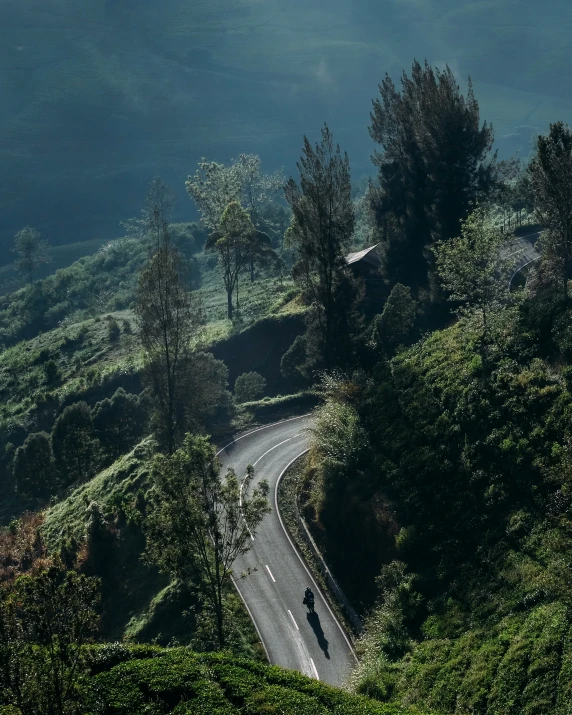 a large mountain side road going down a hill