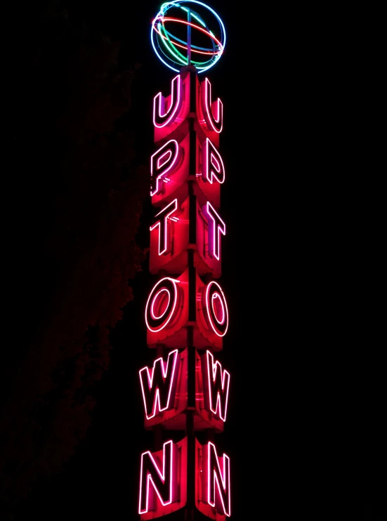 the illuminated sign of a neon casino