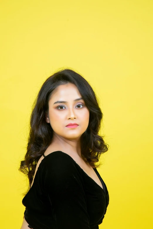 a young woman posing in a black top