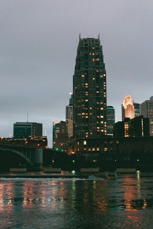 a picture of some lights on a building over water