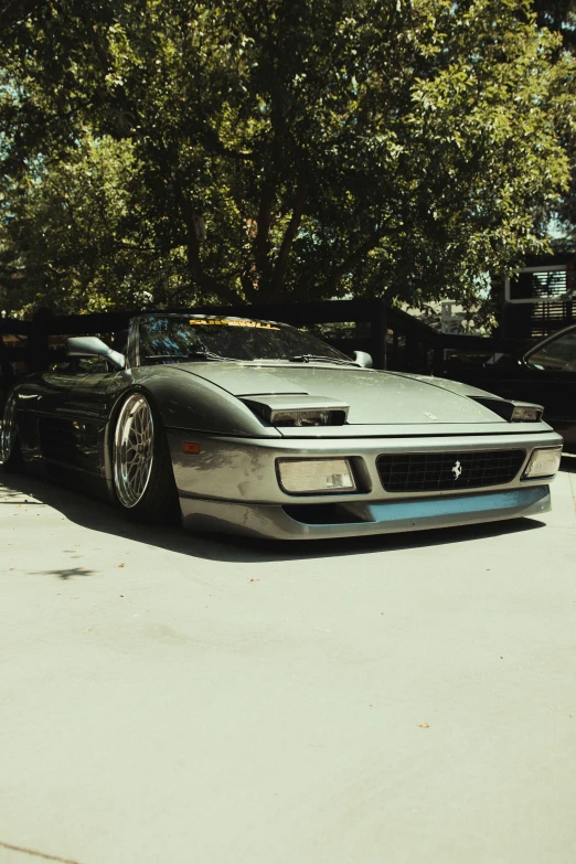 a parked sports car is sitting on the side of a driveway