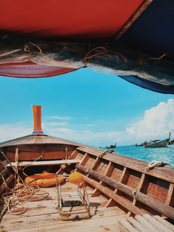 view from the bottom deck of a small wooden boat