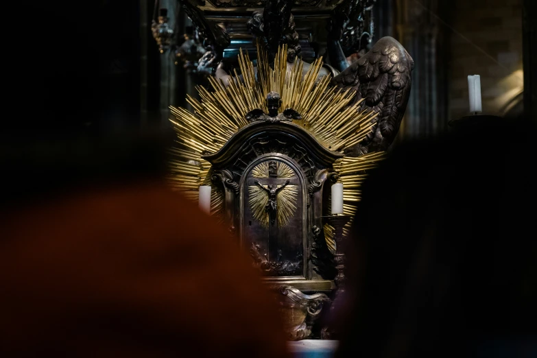 an ornate alter with a gold and silver structure