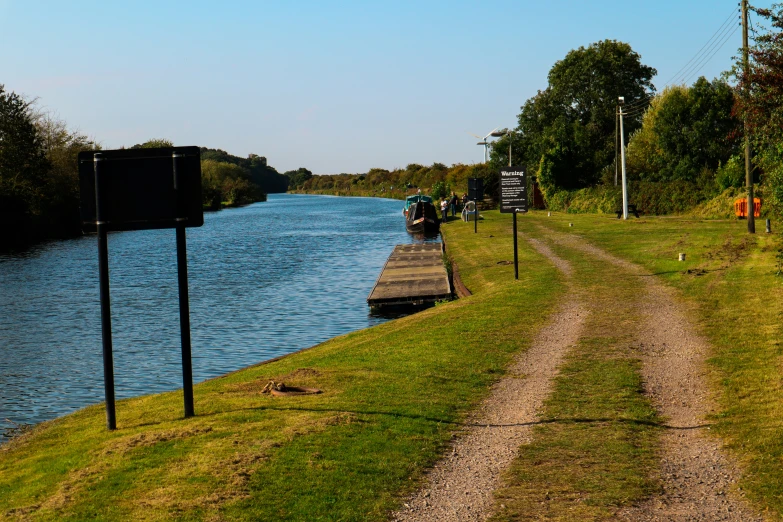 an empty road is next to the water