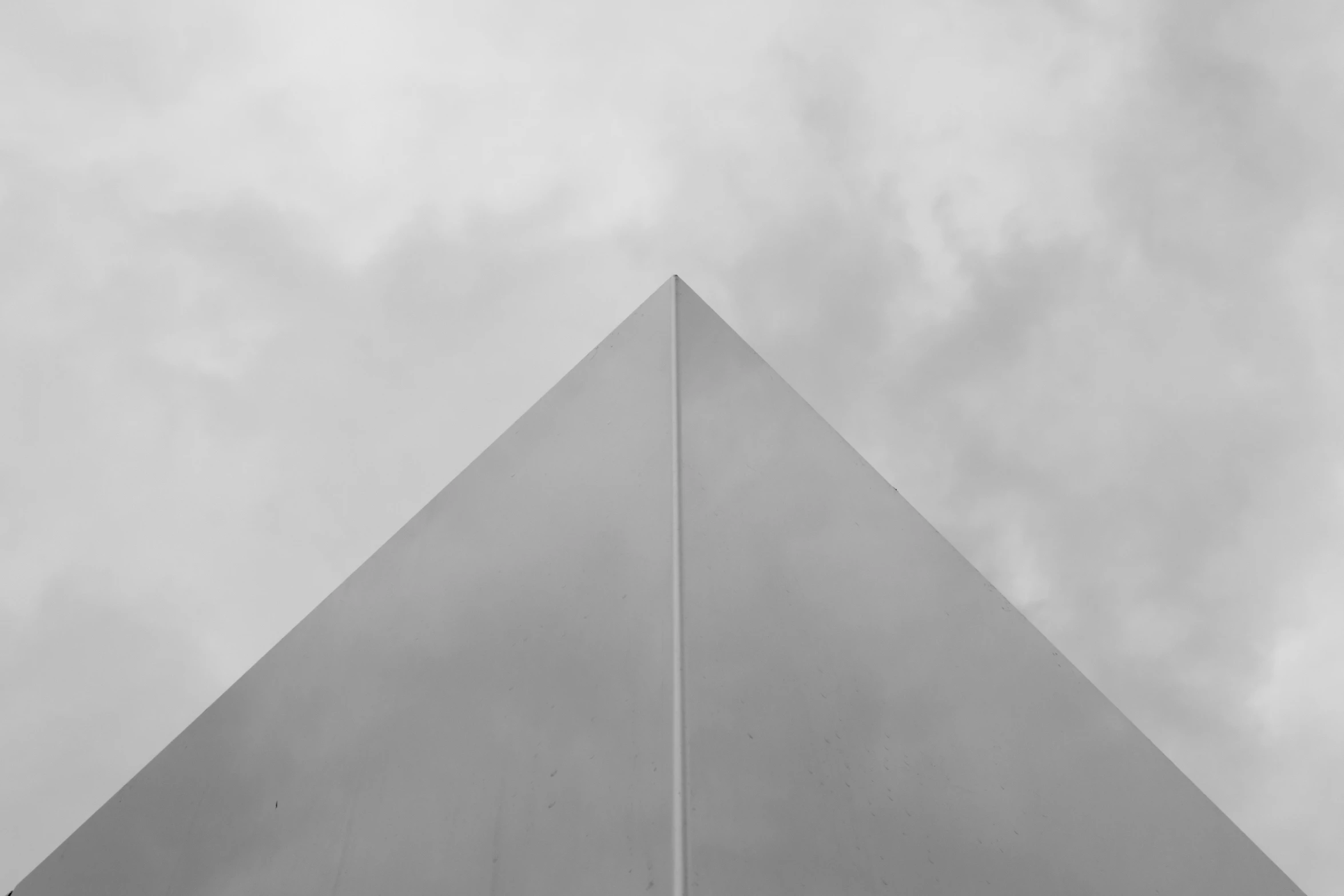a big tall triangle on a grey cloudy day