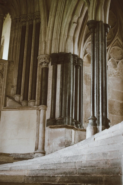 an antique style po of two pillars in the navel of a building