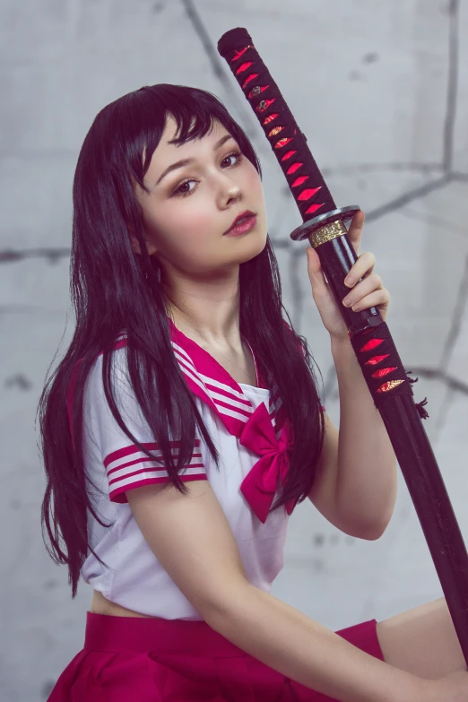 the young woman is posing with her baseball bat