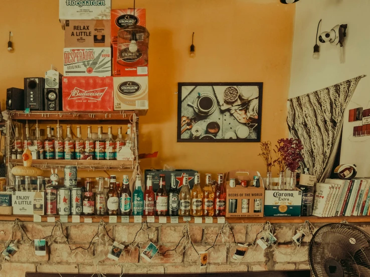 a shelf in a restaurant is full of bottles and liquor