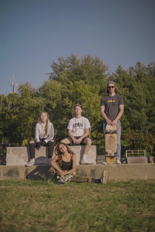 a group of people sitting on concrete steps