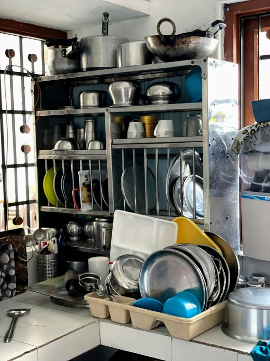 a cupboard full of dishes that are in some type of shelf