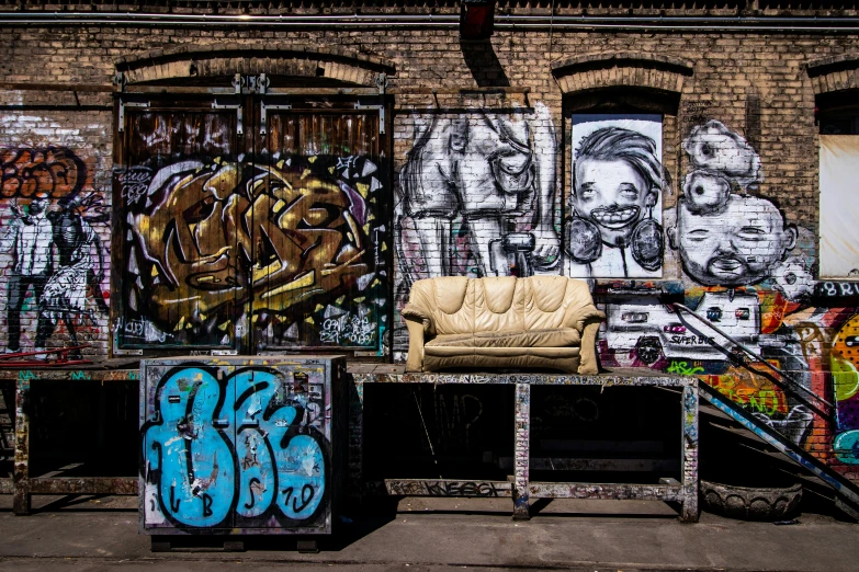 graffiti is painted on the walls and behind a couch