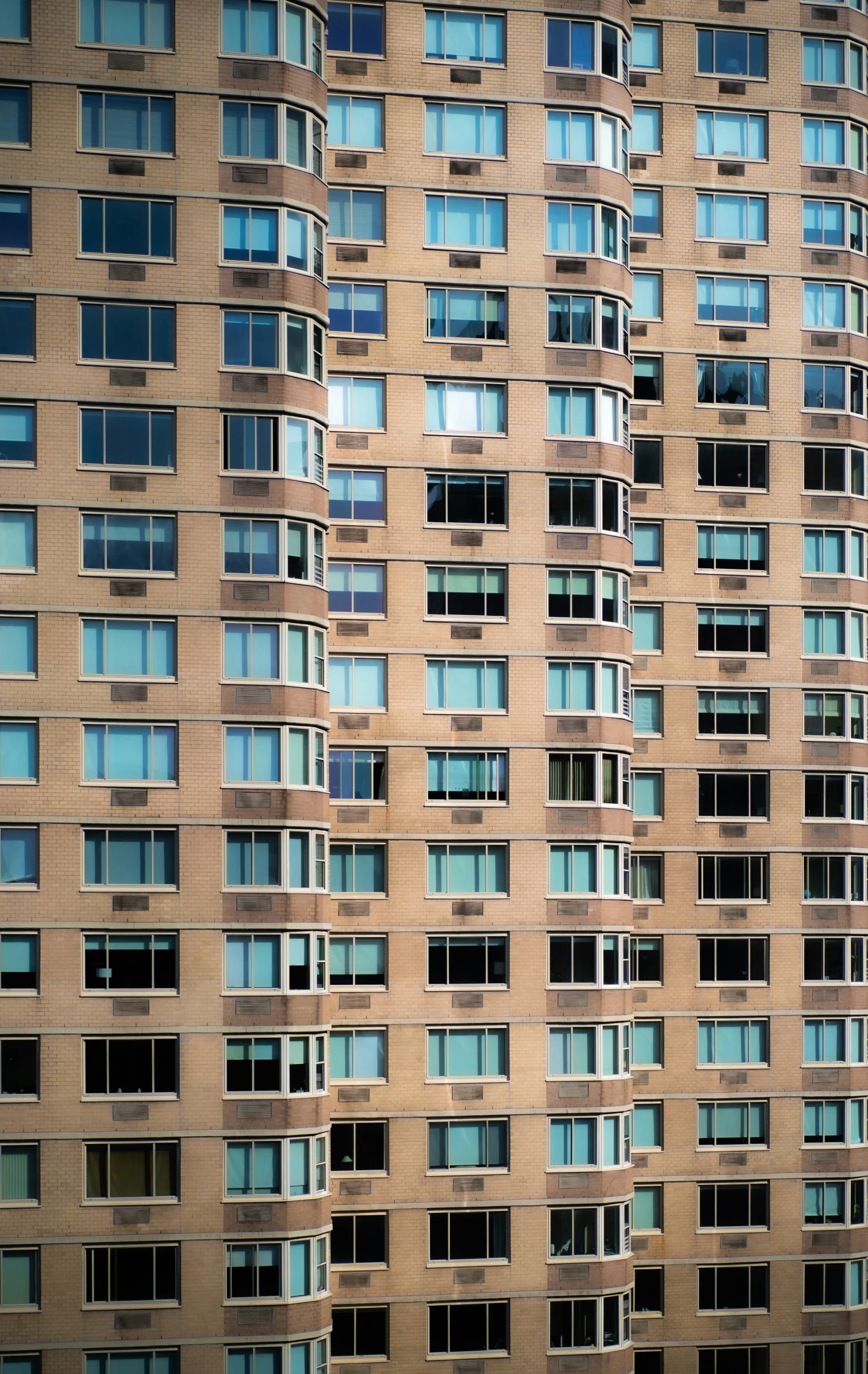 the front view of an architectural building with lots of windows