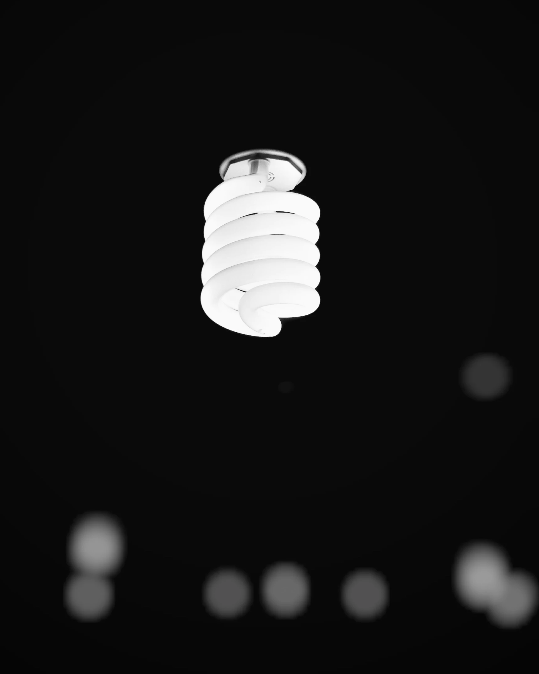 a picture of light bulbs hanging from the ceiling