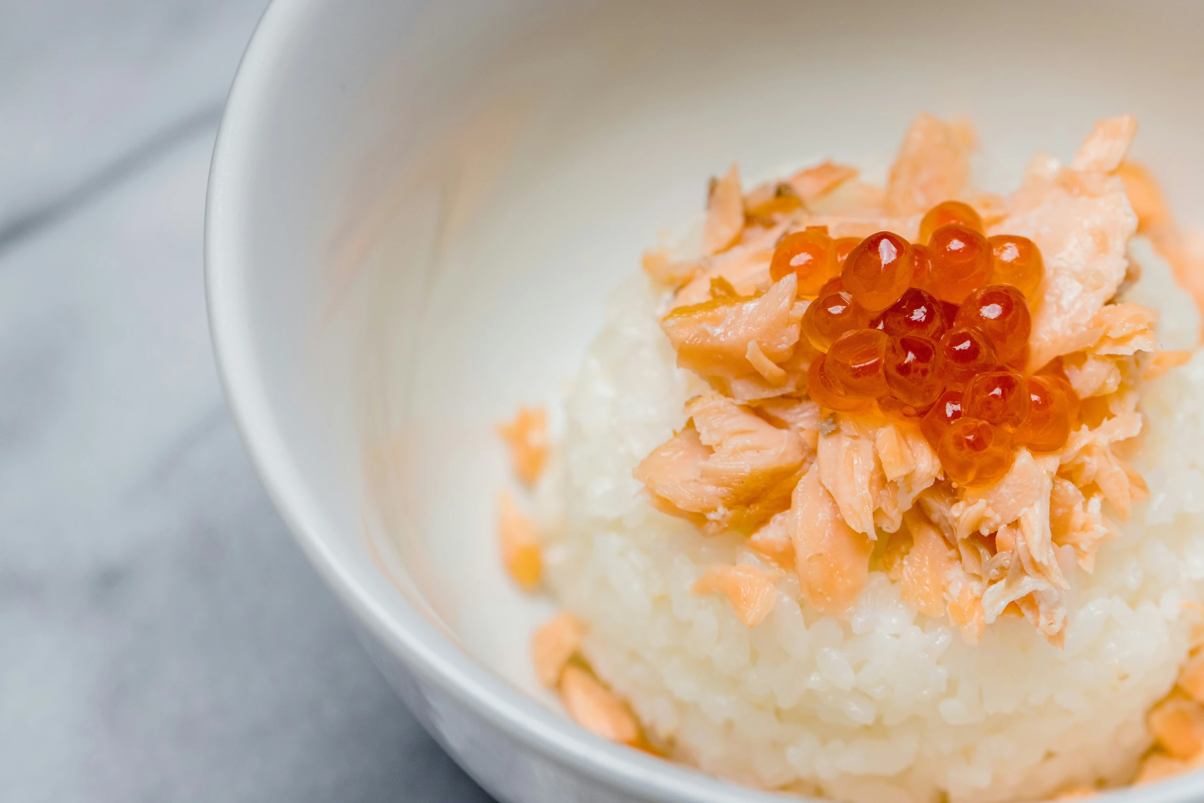 a plate is covered with rice and red cavias