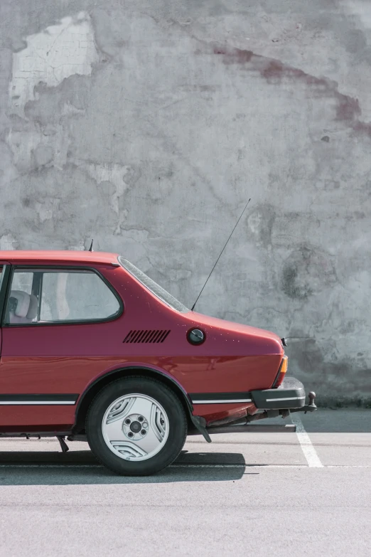 a red car parked in a parking lot