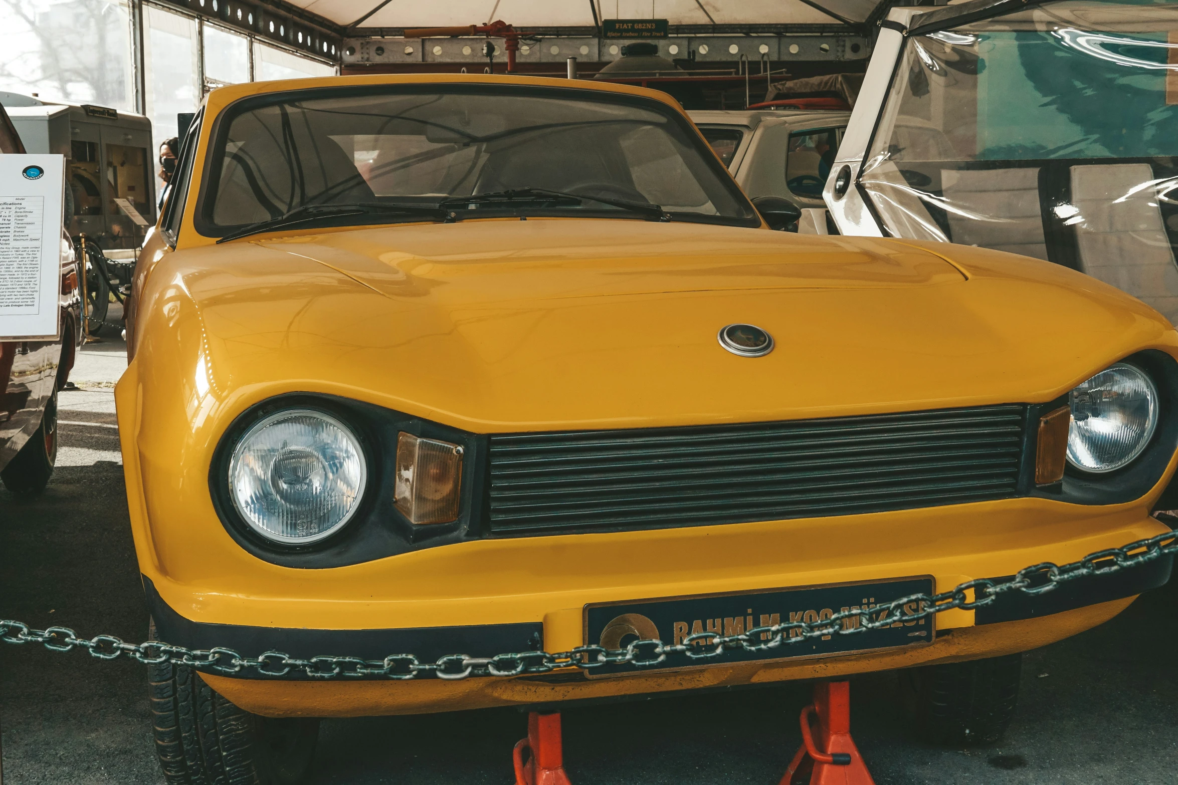 a close up of a car on display at a museum