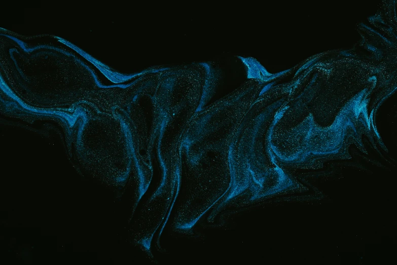 some dark and bright blue colors on black paper