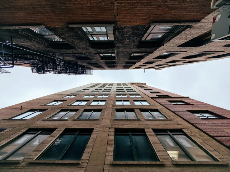 looking up at an upward view of a brick building