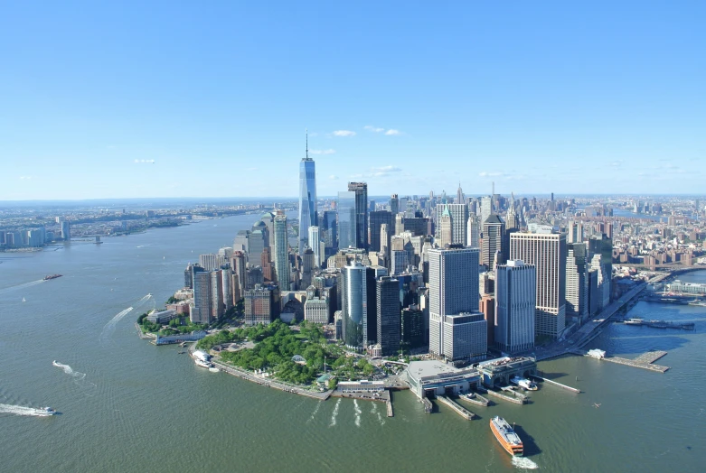 an aerial view of a city with skyscrs and a waterway