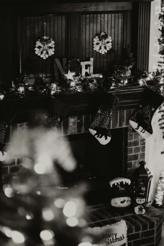 a fireplace and a christmas tree with presents on it