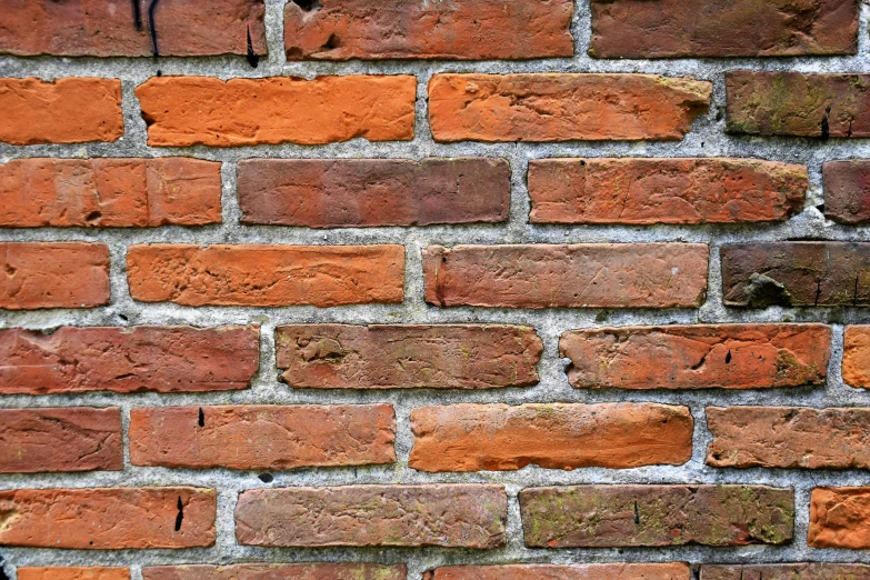 a red brick wall with no mortar or mortar